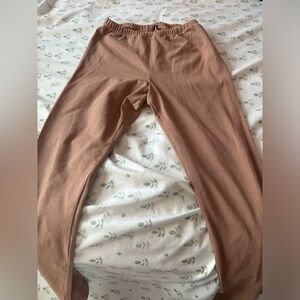 skims outdoor legging in the camel color.